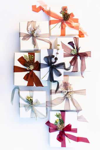 Wedding keepsake boxes tied with locally-sourced ribbon from Lake Como